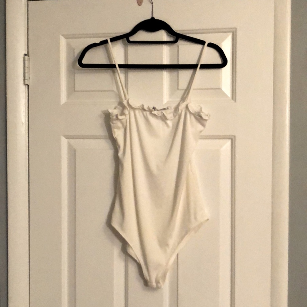 Body suit with ruffles